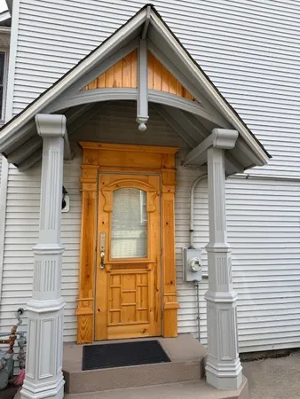 a view of entryway with wooden floor