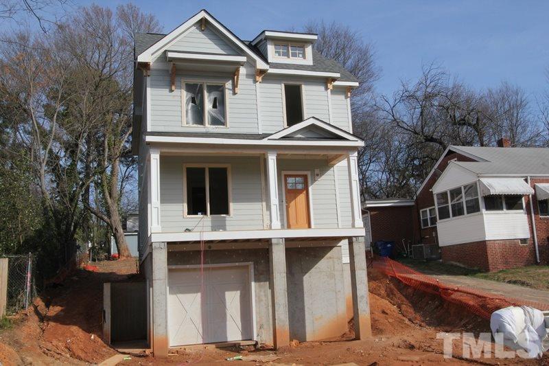 707 South State Street Raleigh, NC 27601 - Photo 1 of 23 a front view of a house with a yard