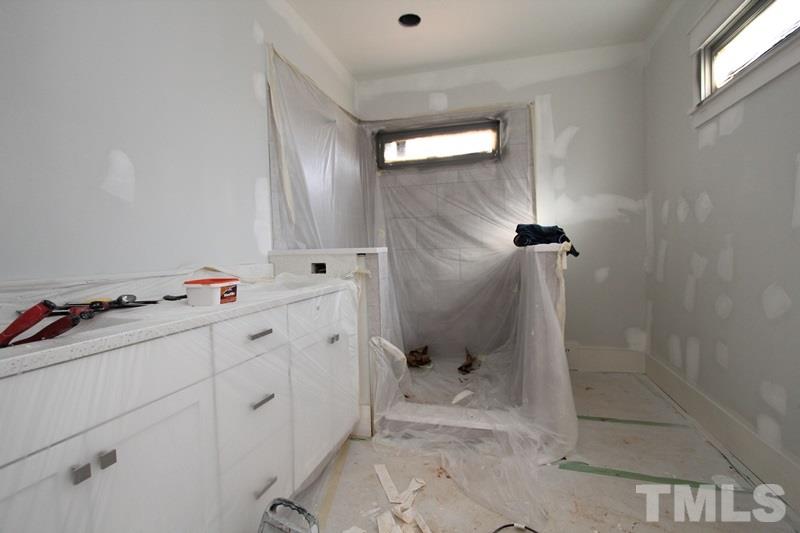 707 South State Street Raleigh, NC 27601 - Photo 17 of 23 a bathroom with a sink toilet and shower