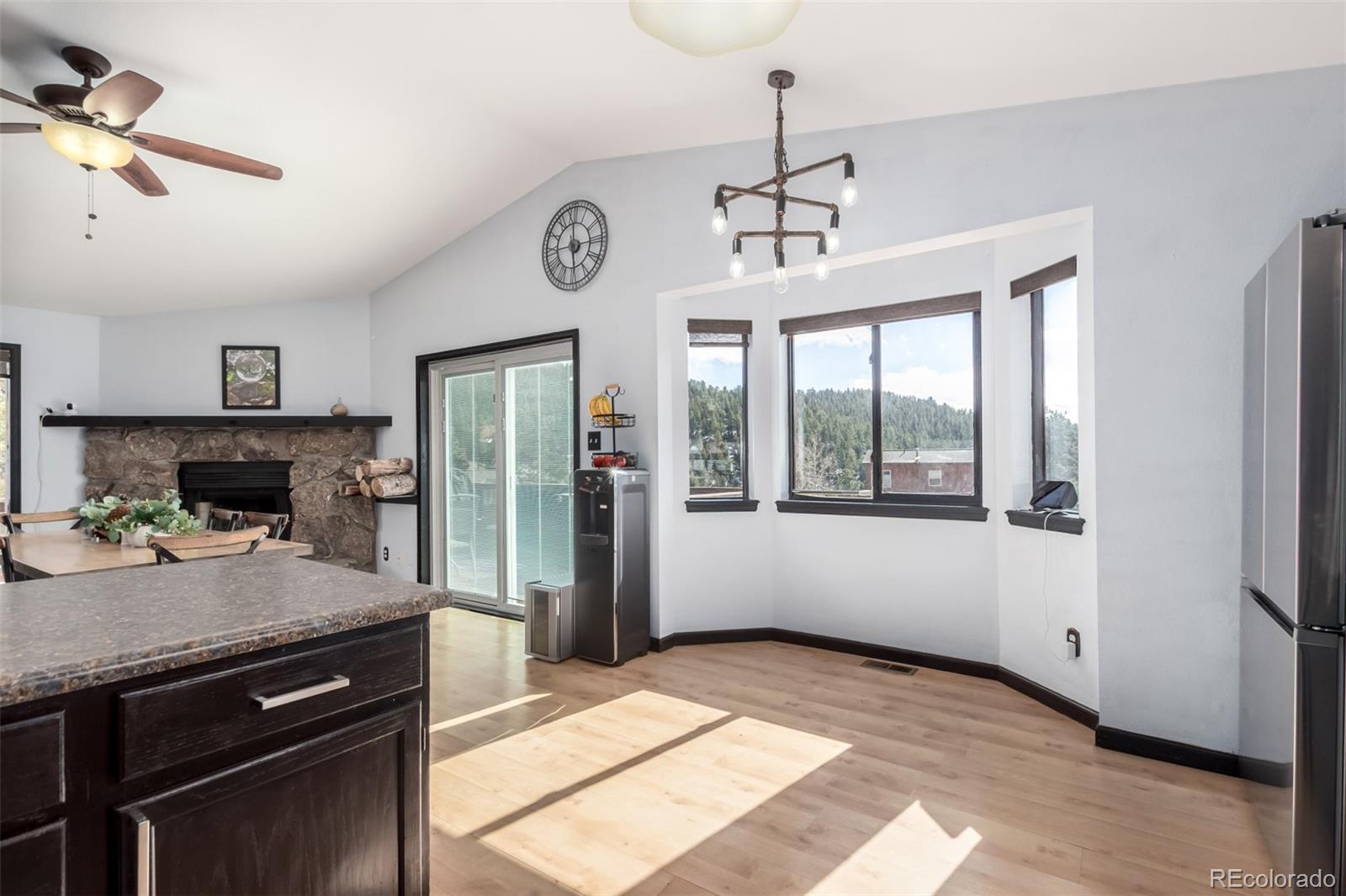 121 Sunlight Lane Bailey, CO 80421 - Photo 12 of 30 a kitchen with a refrigerator a stove a sink and a window