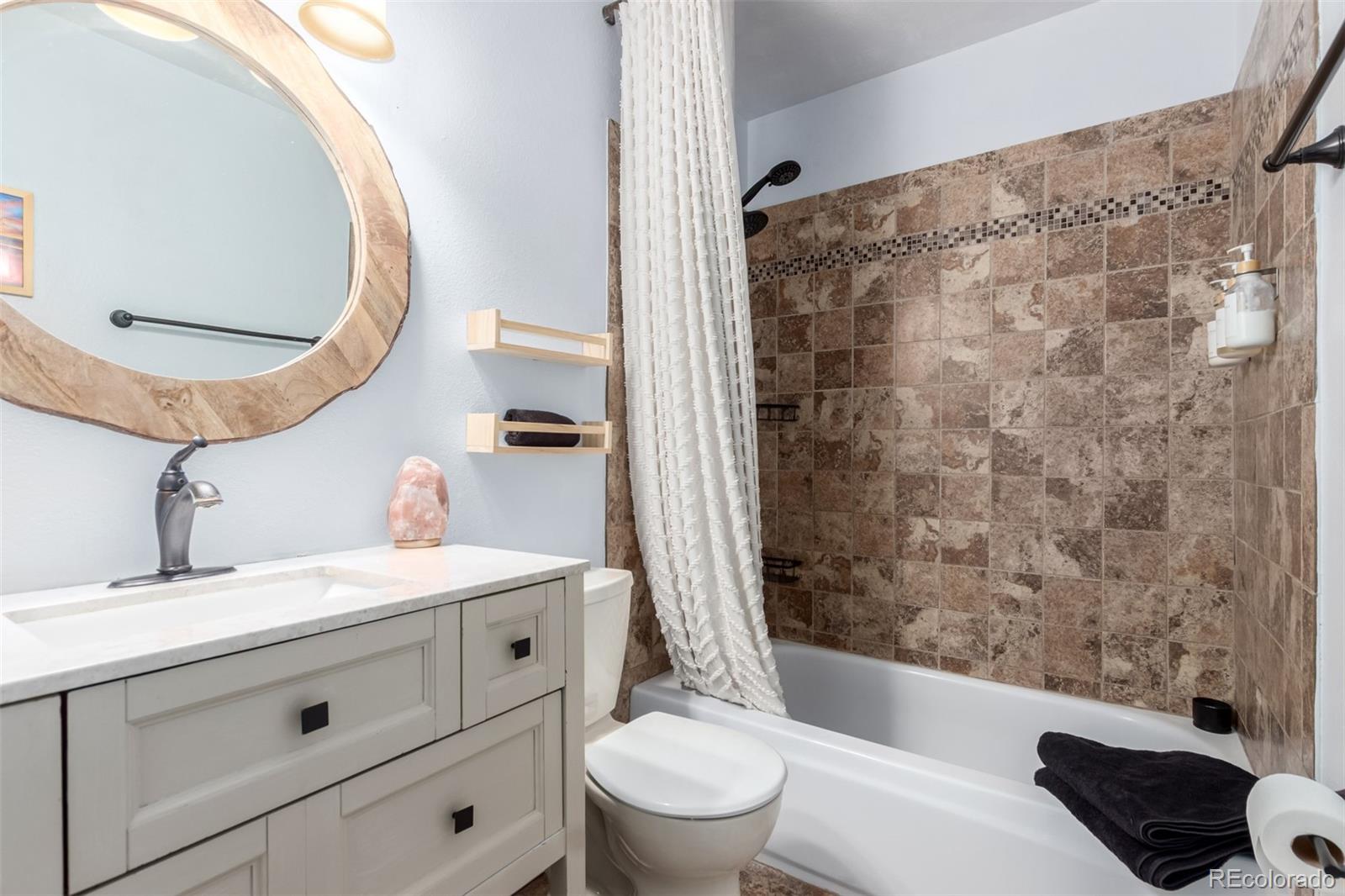 121 Sunlight Lane Bailey, CO 80421 - Photo 16 of 30 a bathroom with a sink a toilet and a mirror