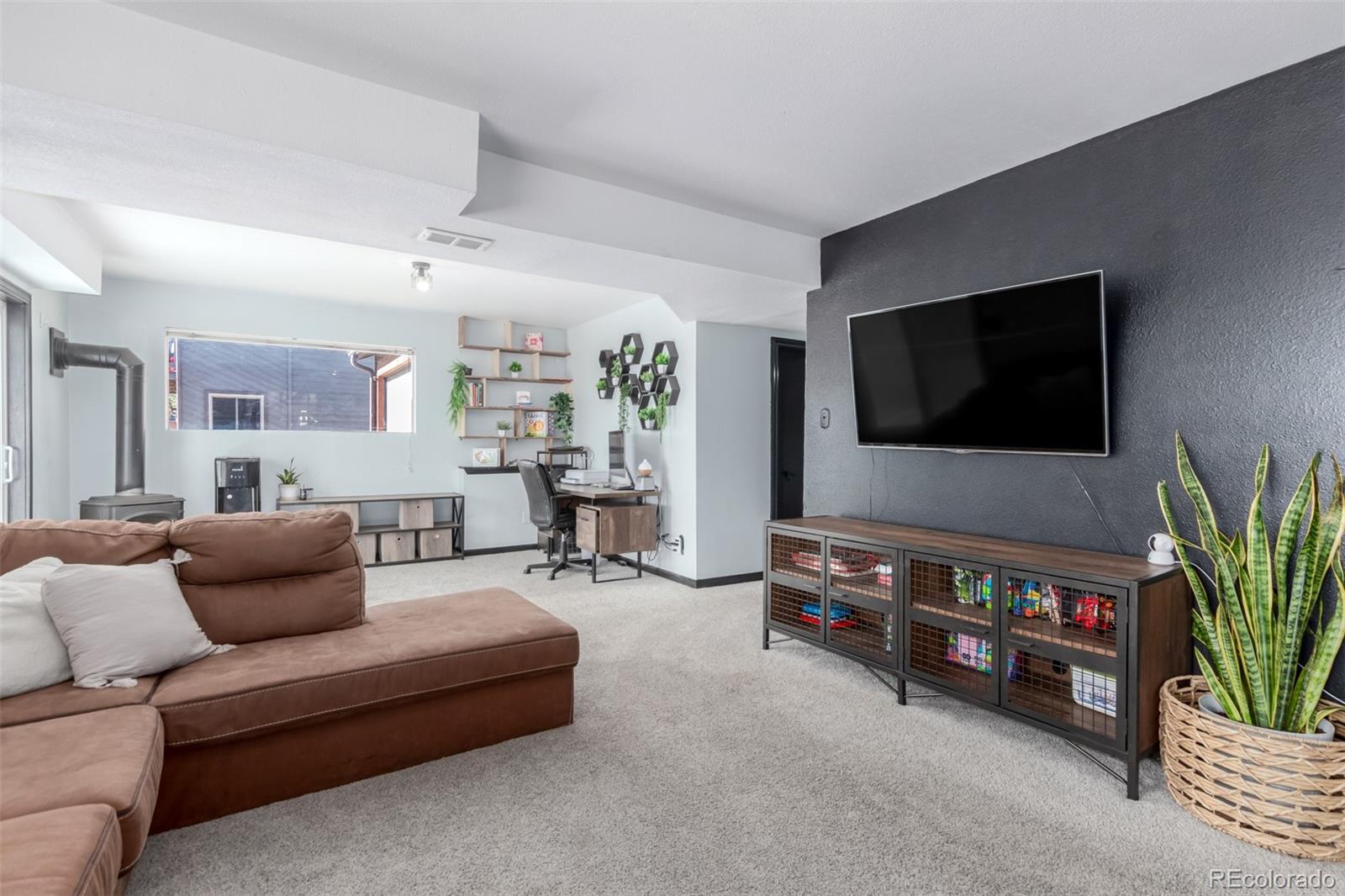 121 Sunlight Lane Bailey, CO 80421 - Photo 19 of 30 a living room with furniture and a flat screen tv