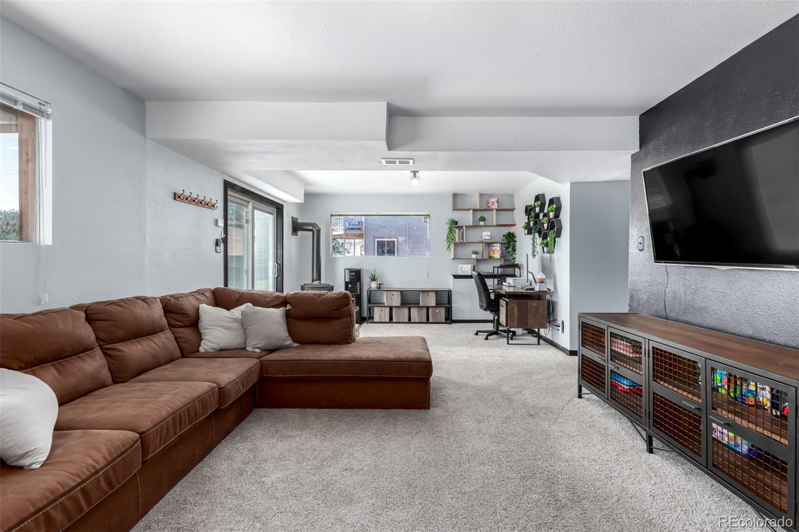 121 Sunlight Lane Bailey, CO 80421 - Photo 20 of 30 a living room with furniture and a flat screen tv