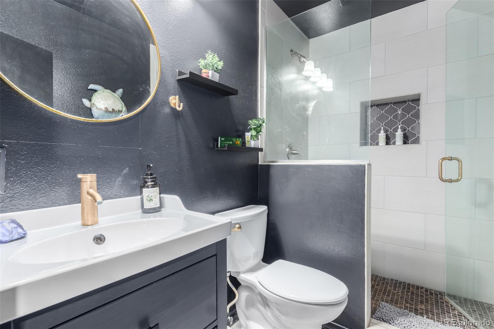 121 Sunlight Lane Bailey, CO 80421 - Photo 24 of 30 a bathroom with a sink mirror and toilet