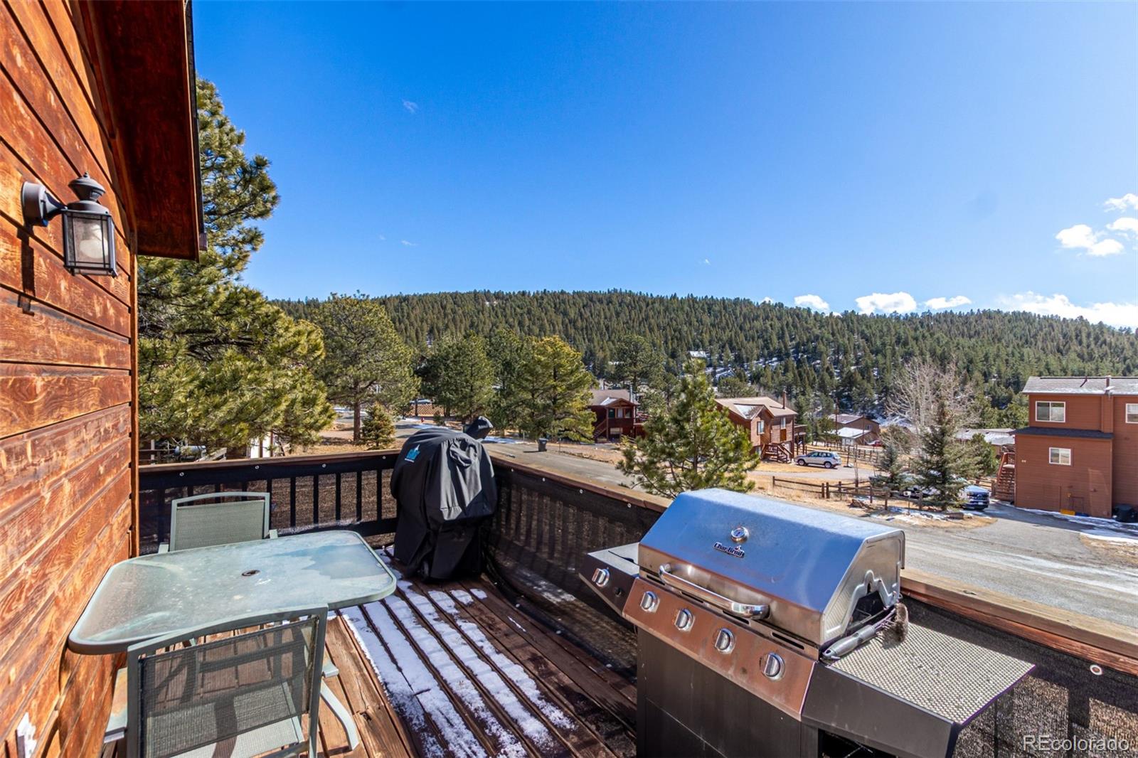 121 Sunlight Lane Bailey, CO 80421 - Photo 29 of 30 a view of a balcony with furniture and a potted plant