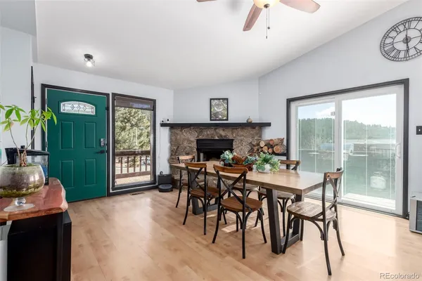 a view of a dining room with furniture window and outside view
