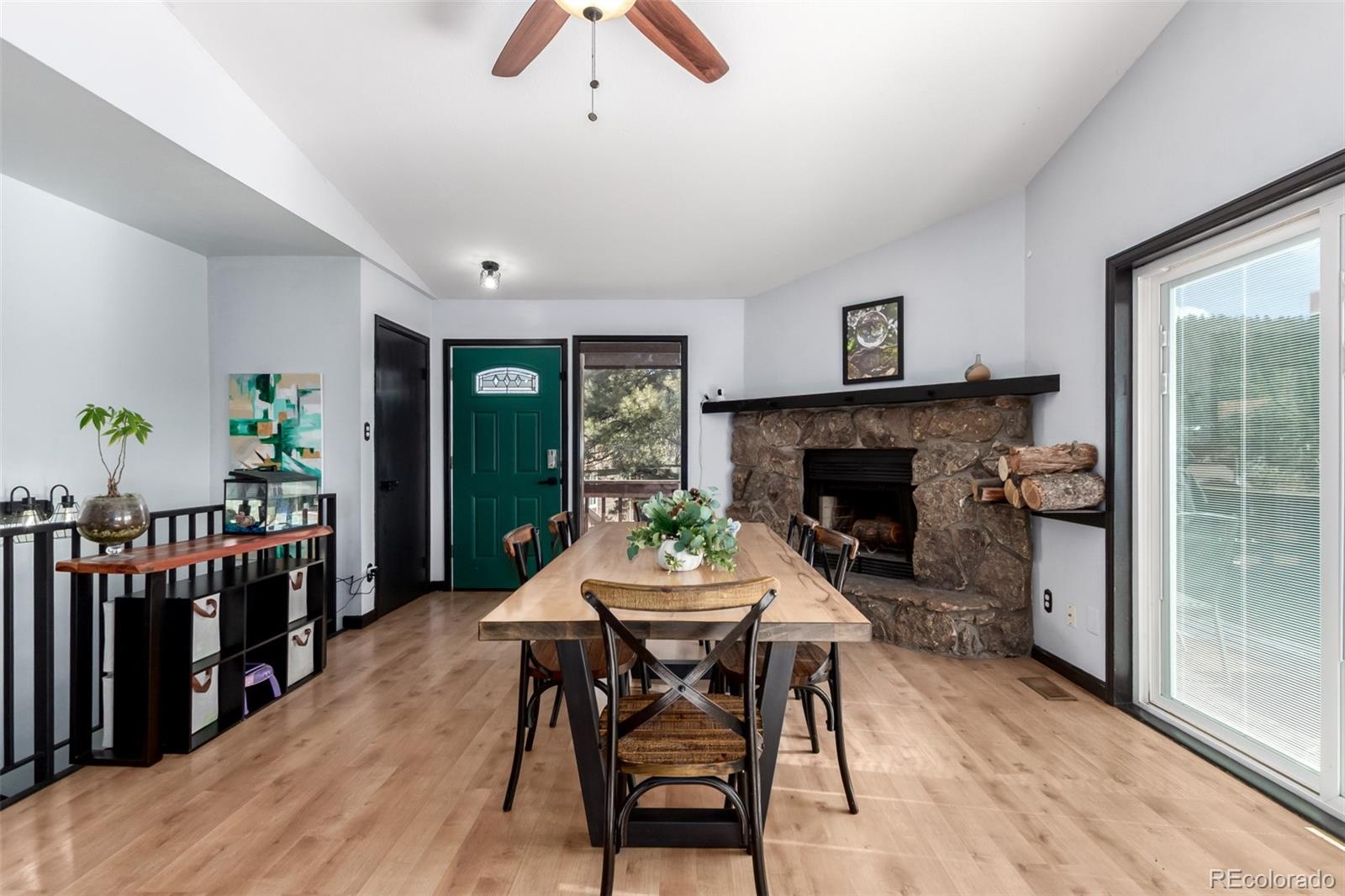 121 Sunlight Lane Bailey, CO 80421 - Photo 7 of 30 a dining room with furniture a rug and wooden floor