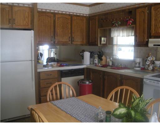 36 Lane F Coventry, RI 02816 - Photo 2 of 12 Kitchen. Back of Kitchen (toward Living Room). LOTS of cabinets!!