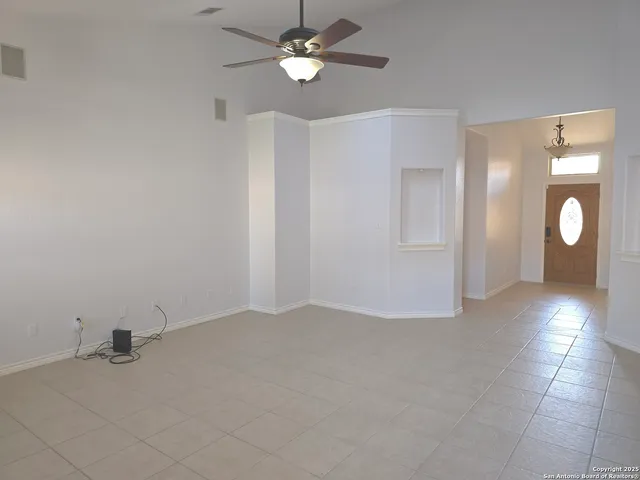 a view of an empty room with a bathroom