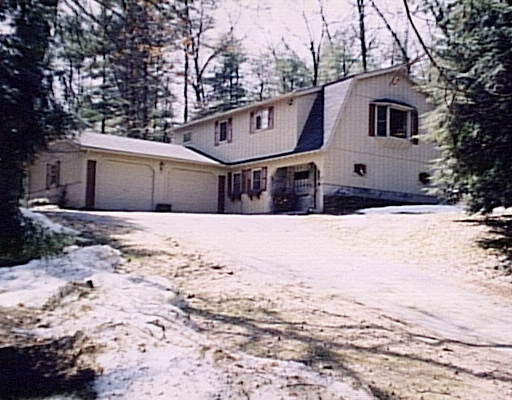 81 Monson Road Brimfield, MA 01010 - Photo 1 of 1 a front view of a house with a yard covered in snow
