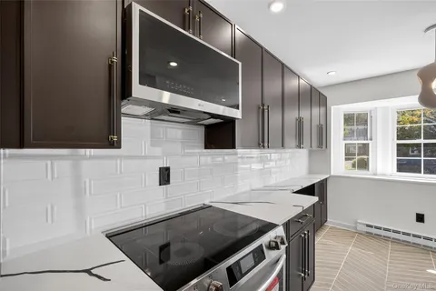 a kitchen with a stove and a microwave