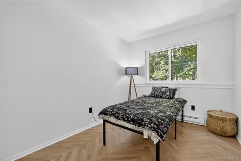 a bedroom with a bed and a table in it