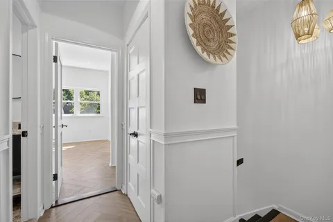 a view of a hallway with entryway to a house