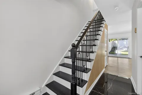 a view of entryway with wooden floor