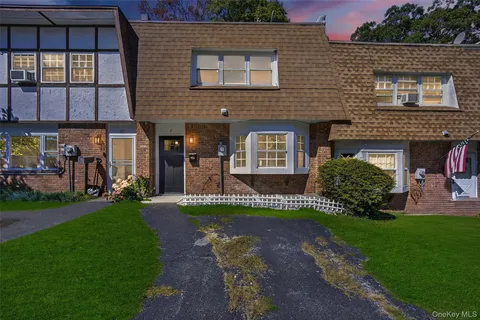 a picture of a bench in front of a wall