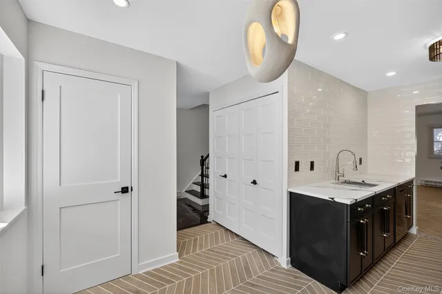 a spacious bathroom with a sink a toilet and a mirror