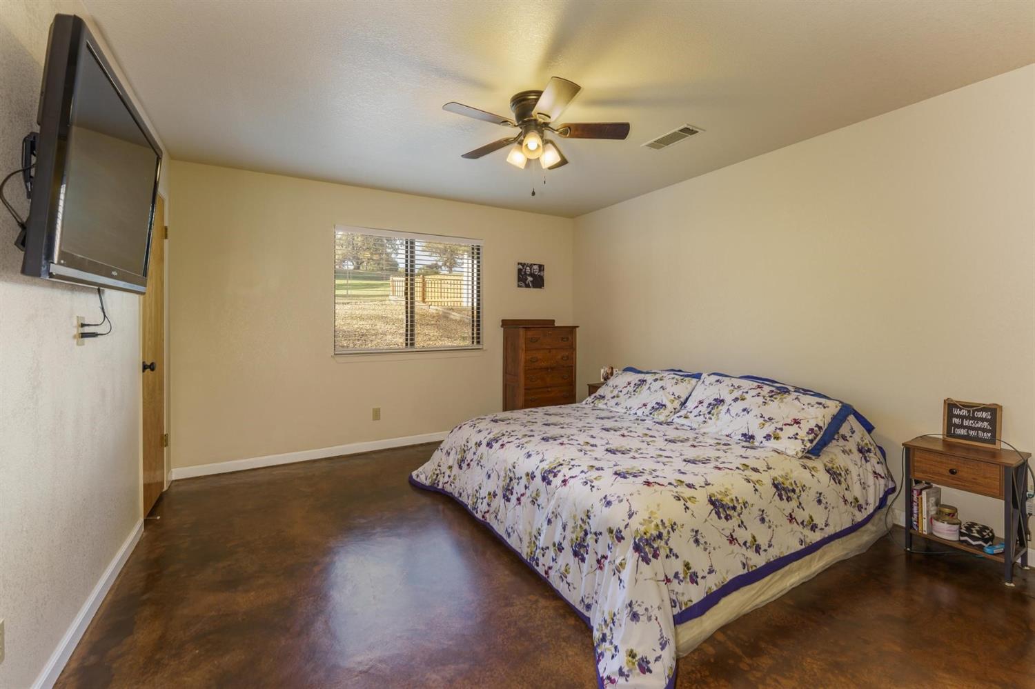 40410 Goldside Drive Oakhurst, CA 93644 - Photo 16 of 24 a bedroom with a bed and a window