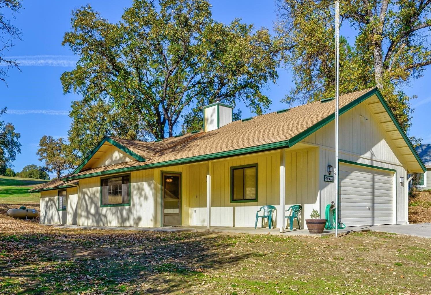 40410 Goldside Drive Oakhurst, CA 93644 - Photo 24 of 24 a front view of a house with a yard