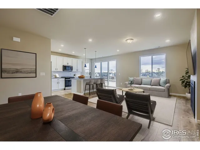 a living room with furniture and a table