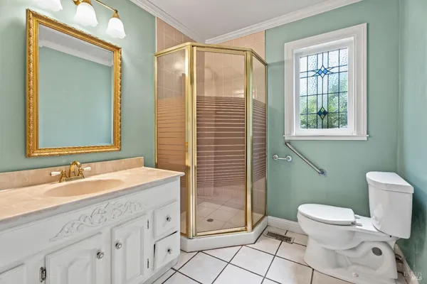 a spacious bathroom with a toilet sink and mirror