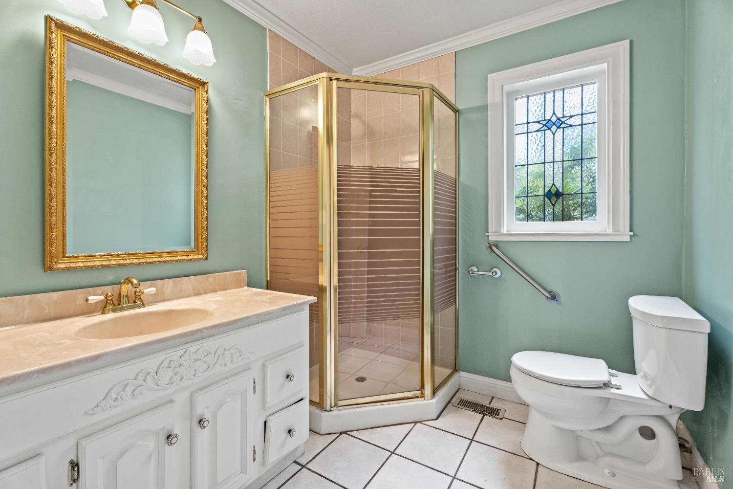 84 School Street Willits, CA 95490 - Photo 15 of 37 a spacious bathroom with a toilet sink and mirror