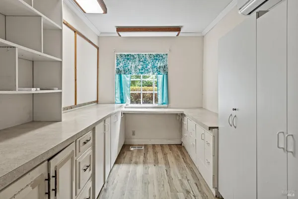 a bathroom with a sink a large mirror and a bathtub