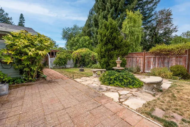 a view of a backyard with sitting area