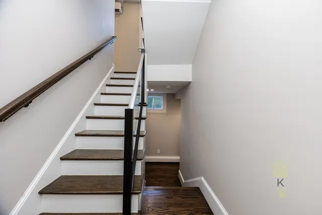 a view of entryway with wooden floor and stair