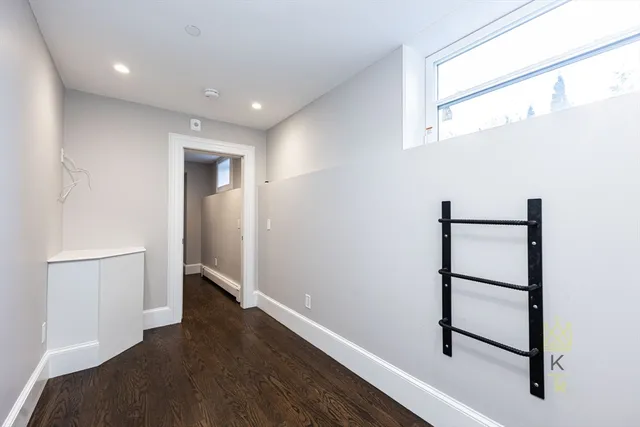a view of room with wooden floor