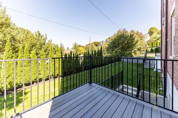 a view of balcony with wooden floor