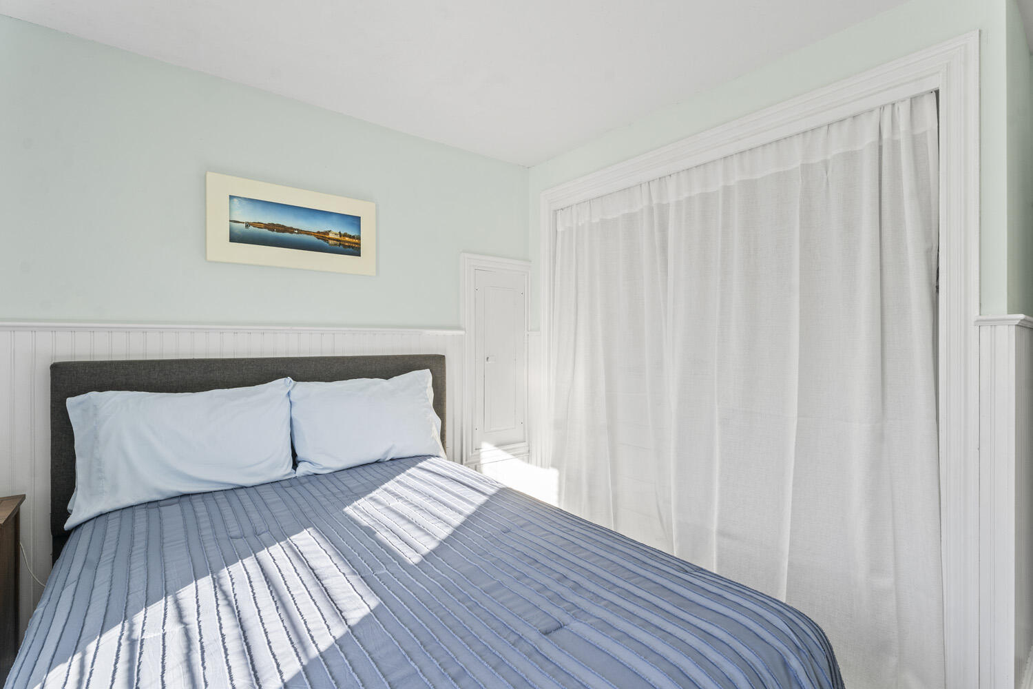 60 Saddle Club Road Edgartown, MA 02539 - Photo 12 of 20 a view of a bedroom with wooden floor and a bed