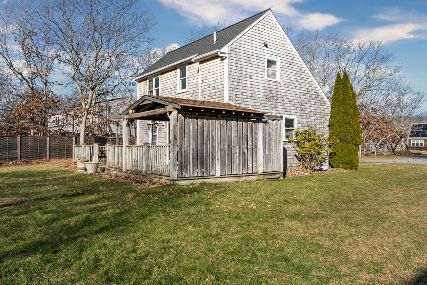 60 Saddle Club Road Edgartown, MA 02539 - Photo 19 of 20 a view of a house with a yard and garage