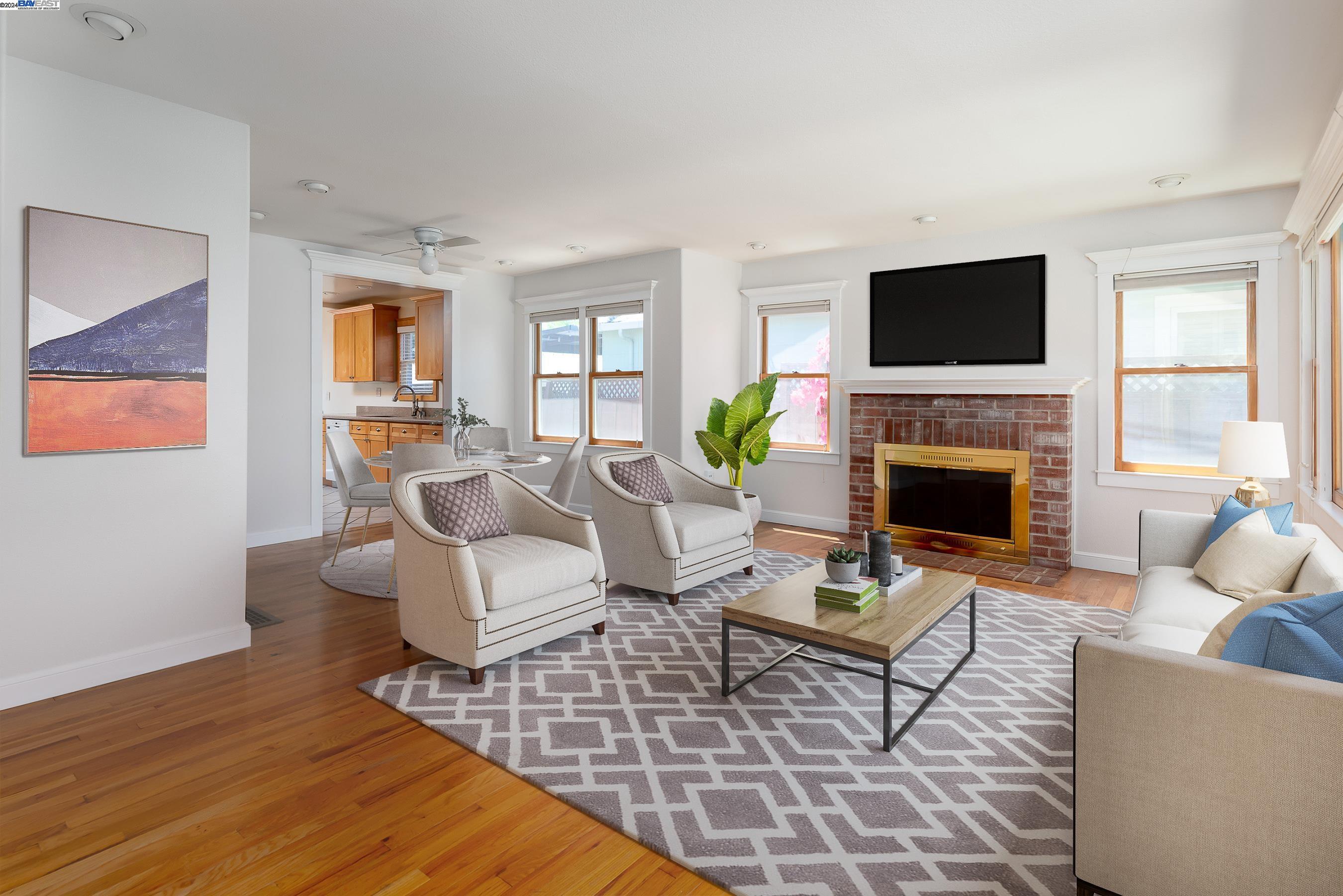 3401 Ricks Avenue Martinez, CA 94553 - Photo 1 of 1 a living room with furniture a flat screen tv and a fireplace