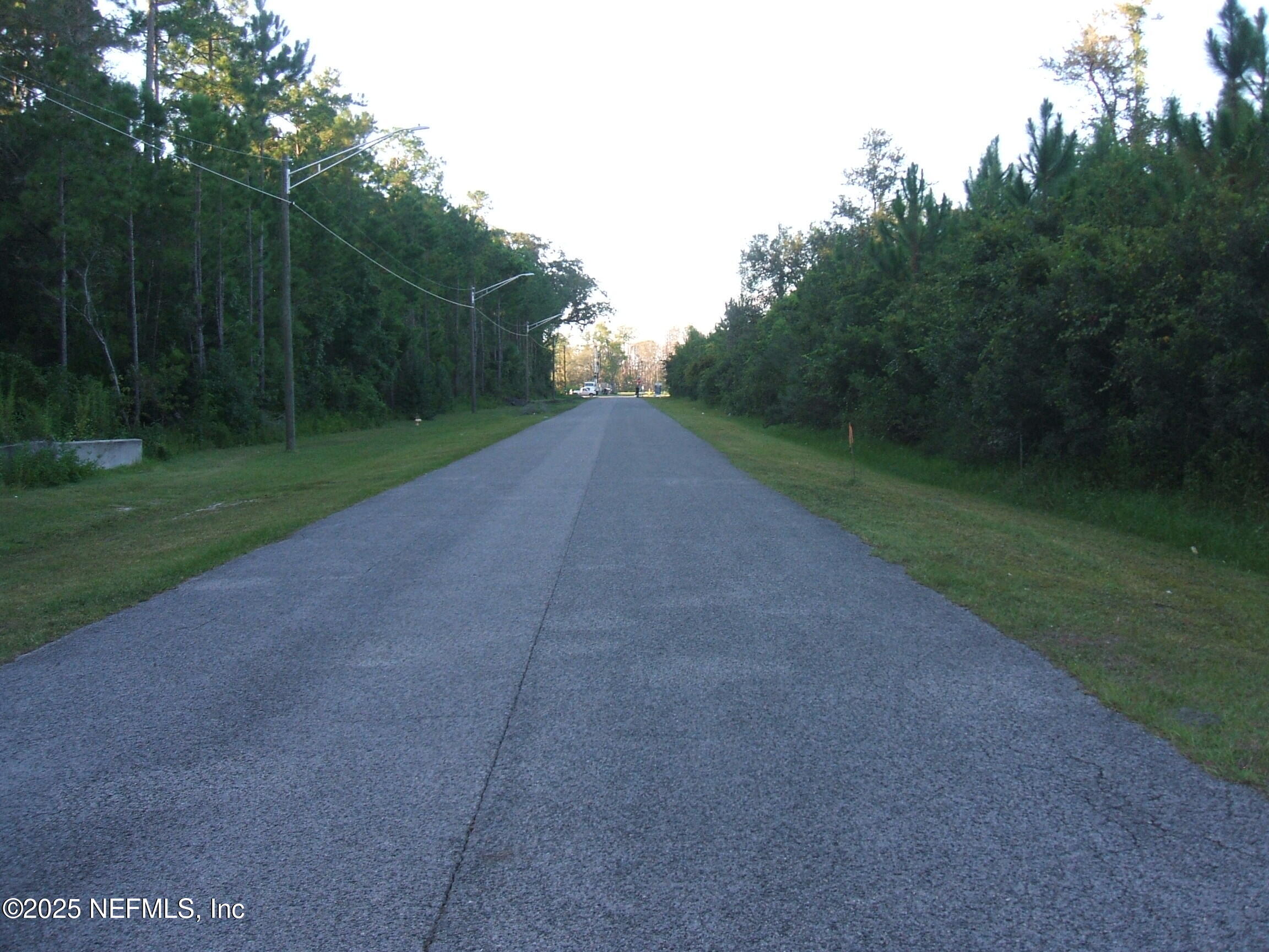 0 Owens Road Jacksonville, FL 32218 - Photo 16 of 20 a view of a field with a trees in the background