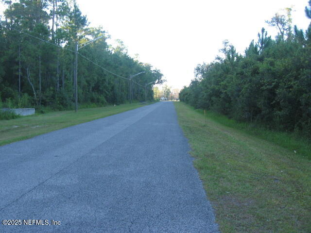 0 Owens Road Jacksonville, FL 32218 - Photo 4 of 20 a view of a field with a trees in the background