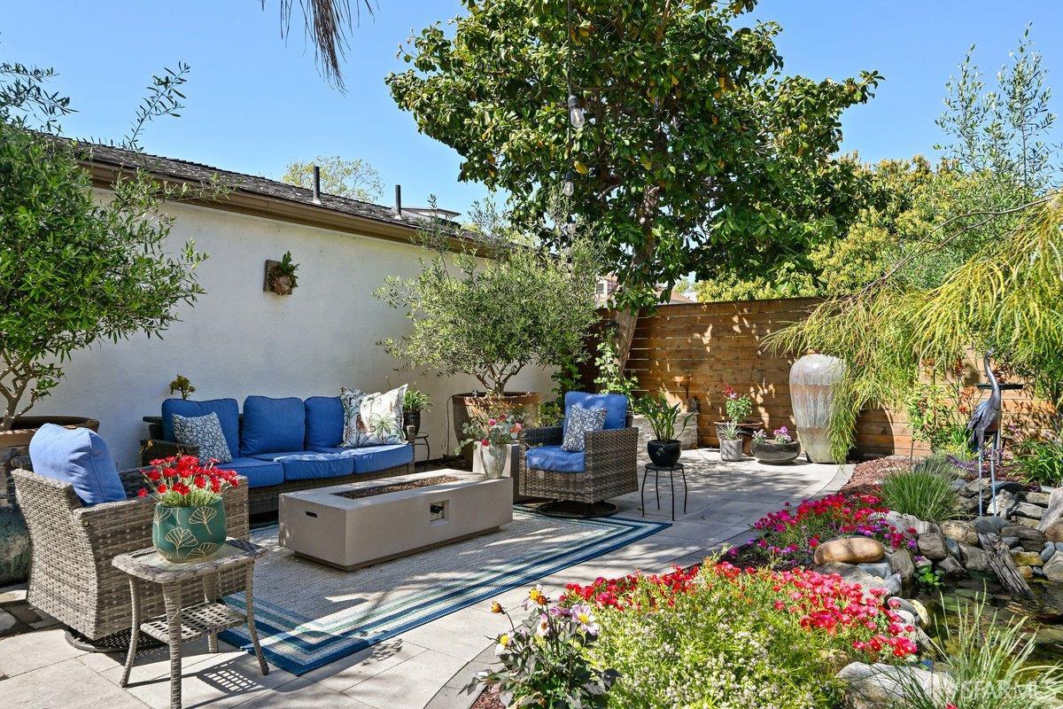 2445 Encinal Avenue Alameda, CA 94501 - Photo 19 of 78 a view of a patio with couches and a flower pot with wooden fence