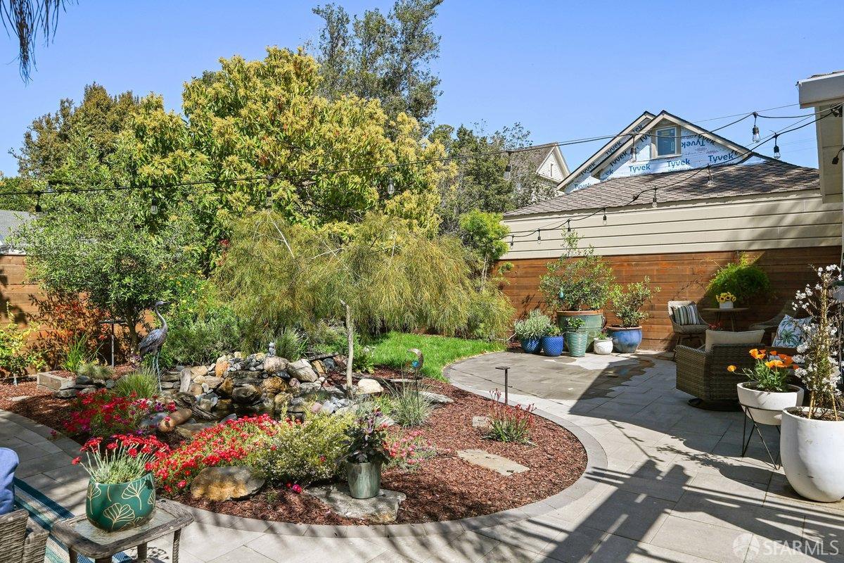 2445 Encinal Avenue Alameda, CA 94501 - Photo 21 of 78 a view of a patio with table and chairs potted plants
