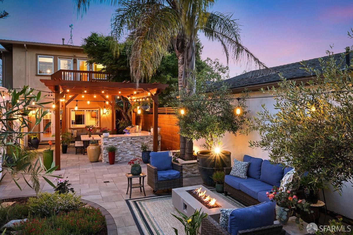 2445 Encinal Avenue Alameda, CA 94501 - Photo 24 of 78 a view of a patio with couches table and chairs and potted plants