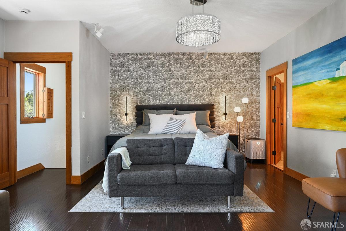 2445 Encinal Avenue Alameda, CA 94501 - Photo 30 of 78 a living room with furniture wooden floor and a chandelier