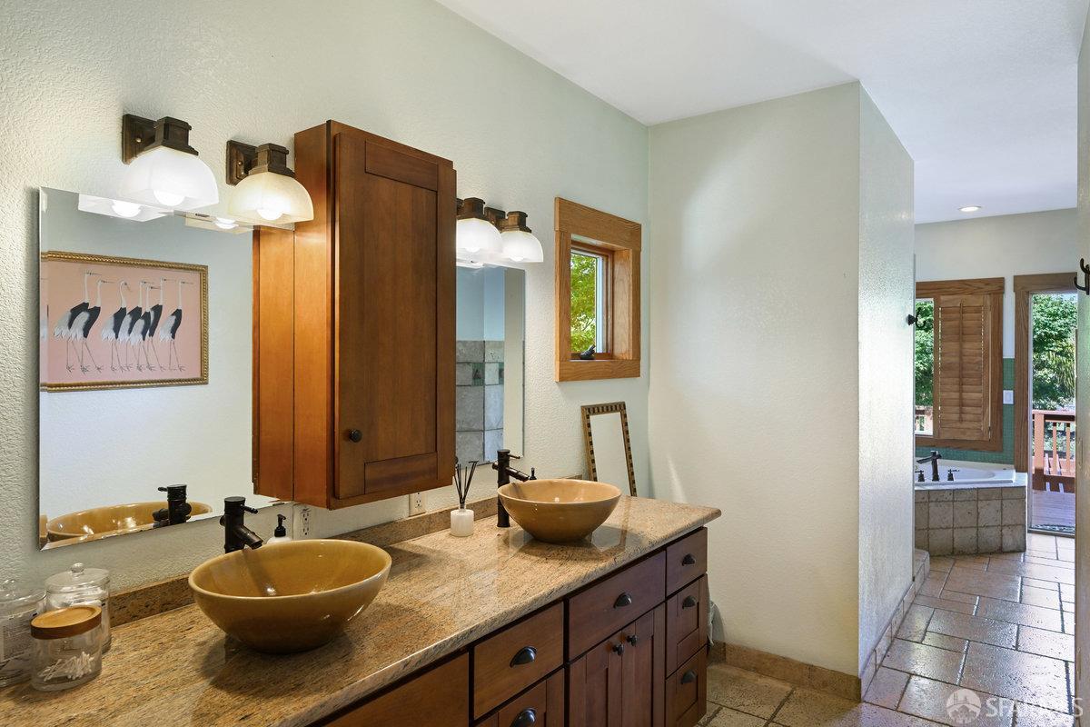 2445 Encinal Avenue Alameda, CA 94501 - Photo 35 of 78 a bathroom with a granite countertop sink and a mirror