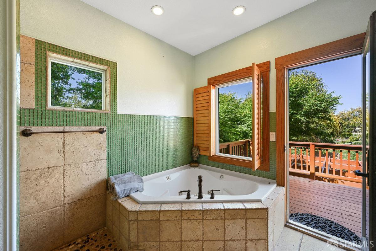 2445 Encinal Avenue Alameda, CA 94501 - Photo 37 of 78 a bath tub sitting next to a window