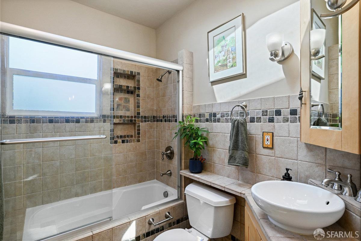 2445 Encinal Avenue Alameda, CA 94501 - Photo 46 of 78 a bathroom with a sink mirror toilet and bathtub