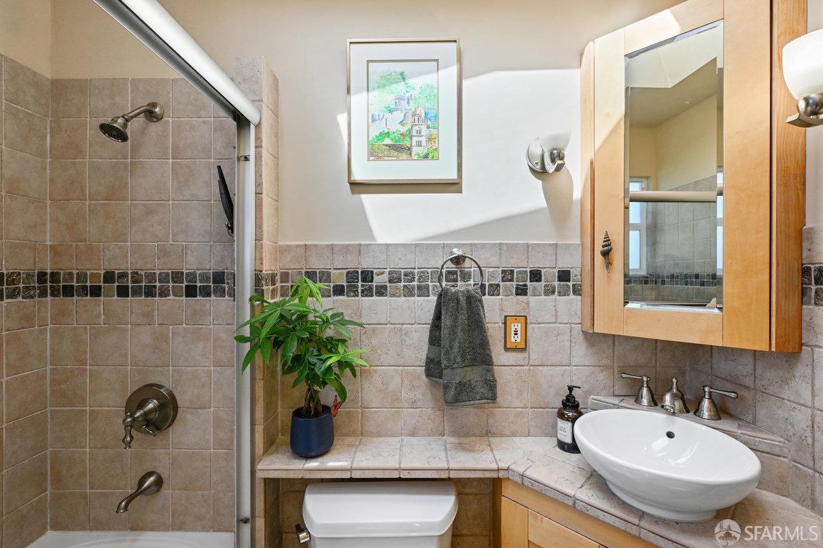 2445 Encinal Avenue Alameda, CA 94501 - Photo 47 of 78 a bathroom with a sink and a mirror