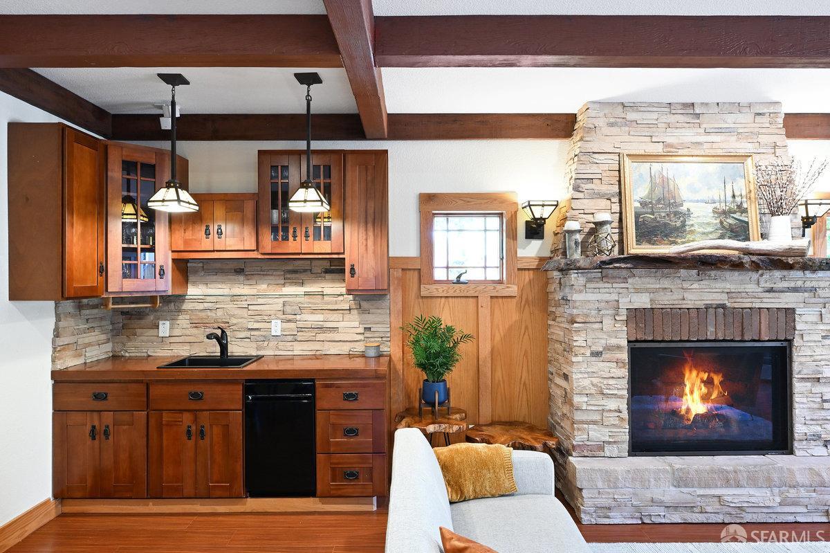 2445 Encinal Avenue Alameda, CA 94501 - Photo 48 of 78 a kitchen with stainless steel appliances granite countertop a stove and a fireplace