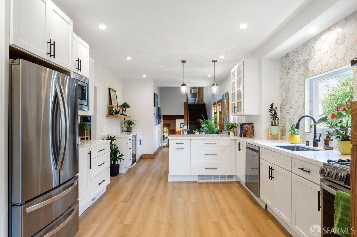 2445 Encinal Avenue Alameda, CA 94501 - Photo 5 of 78 a large kitchen with stainless steel appliances lots of counter space and a sink
