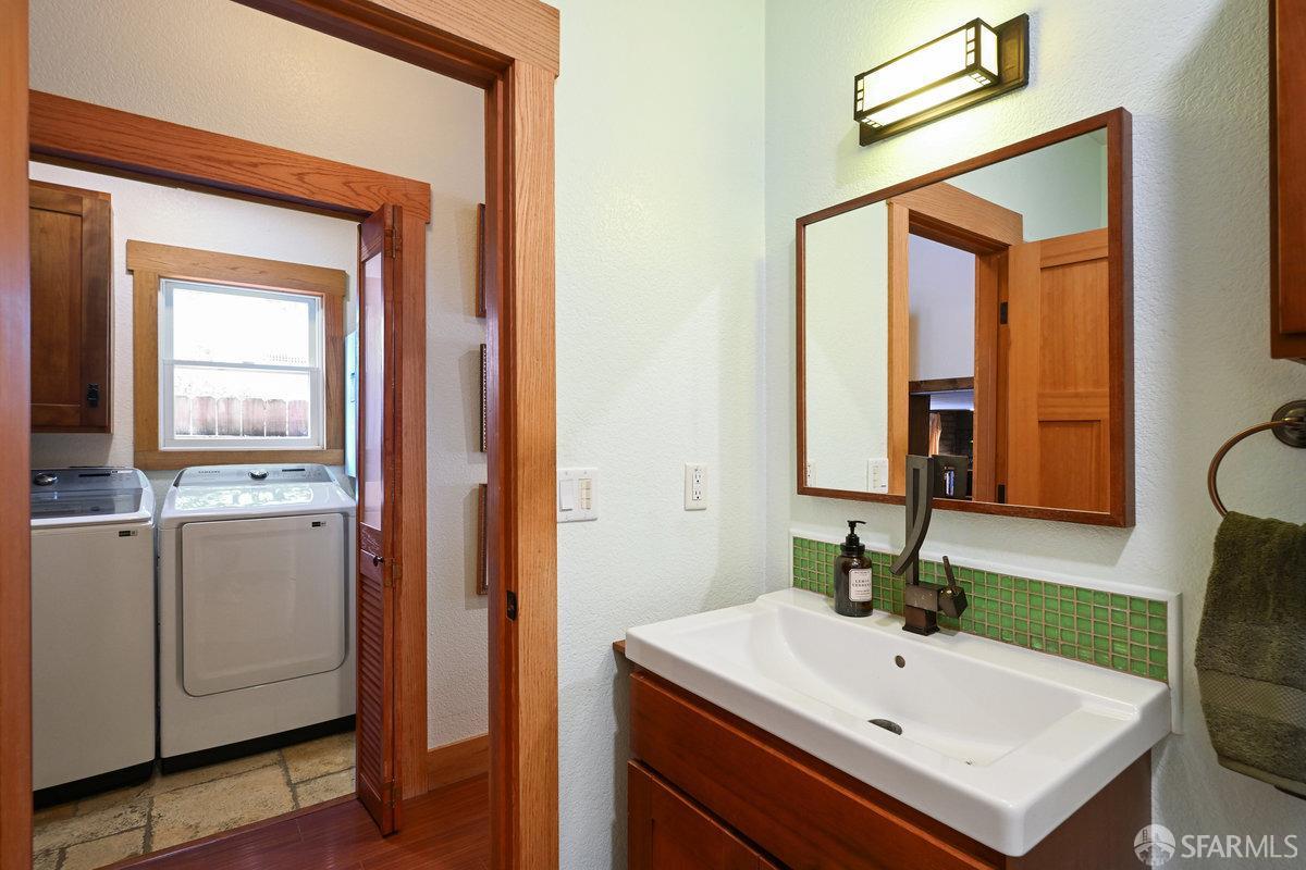2445 Encinal Avenue Alameda, CA 94501 - Photo 53 of 78 a bathroom with a sink a vanity and a mirror