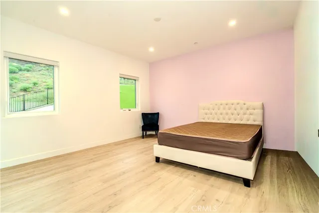 a room with a bed and a window