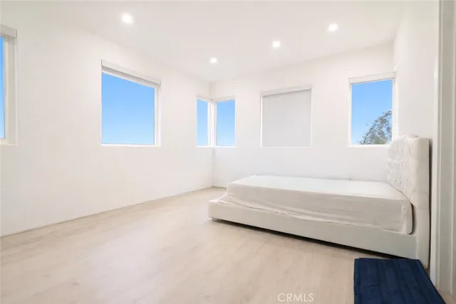 a bathroom with a bathtub and a window