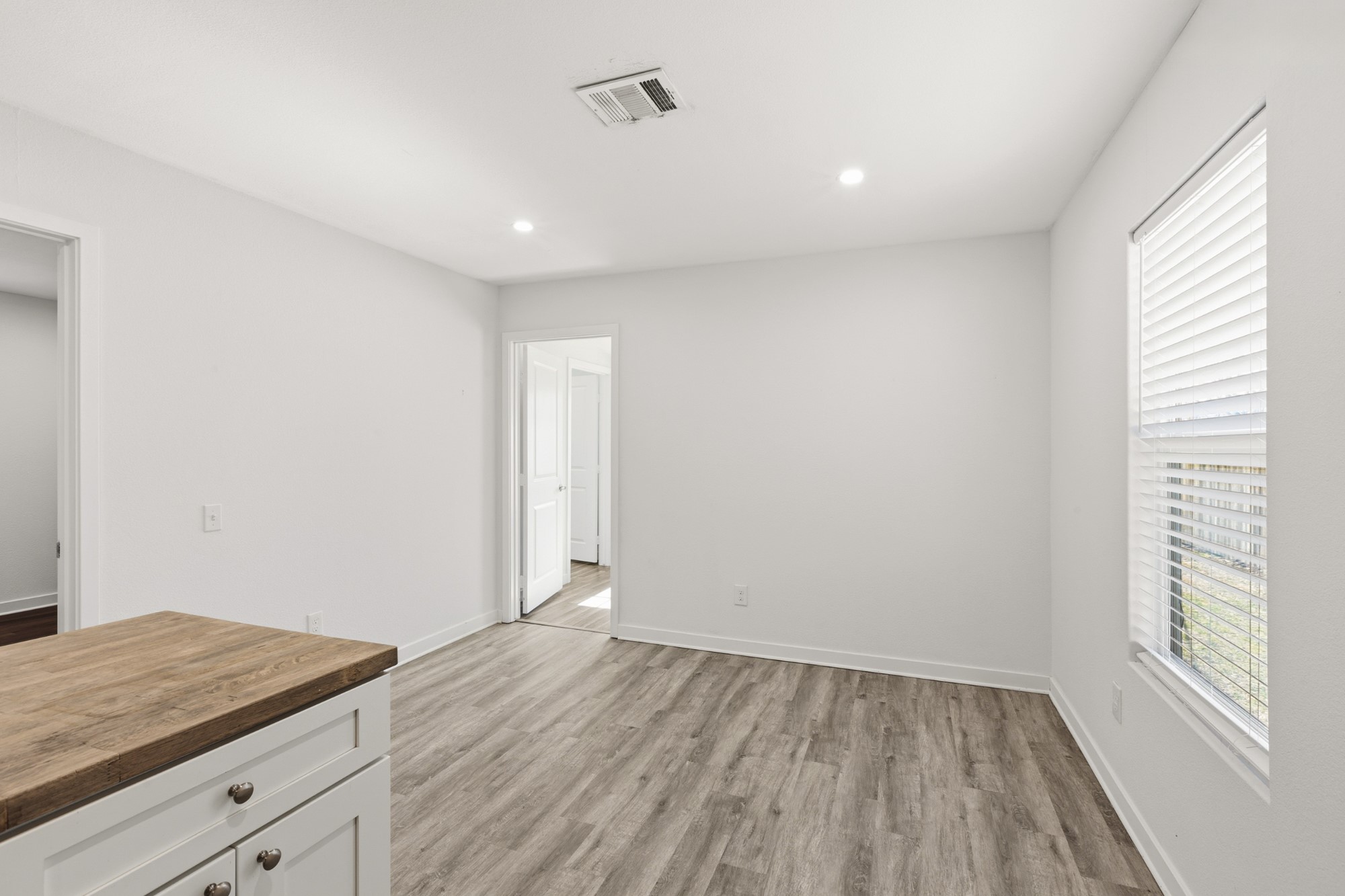 108 Irene Street Elgin, TX 78621 - Photo 12 of 29 Unfurnished dining area with recessed lighting and light wood-type flooring
