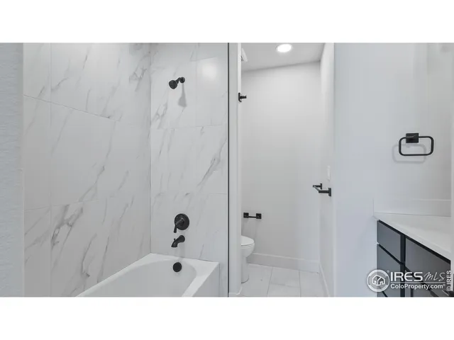 a open hall with a painting on the wall